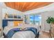 Cozy main bedroom with ocean views and a wood-planked ceiling at 200 72Nd Ave. N # 501, Myrtle Beach, SC 29572