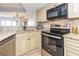 Well-equipped kitchen with modern appliances and granite countertops at 200 72Nd Ave. N # 501, Myrtle Beach, SC 29572