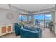 Bright living room showcases coastal style with ocean views and balcony access, offering seaside relaxation at 200 72Nd Ave. N # 501, Myrtle Beach, SC 29572