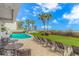 Enjoy a community pool with seating, lawn, and palm trees near the beach at 200 72Nd Ave. N # 501, Myrtle Beach, SC 29572