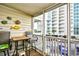 Relaxing screened balcony with seating area and view of the resort at 210 N Ocean Blvd. # 234, North Myrtle Beach, SC 29582