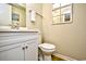 Bright bathroom with a white vanity, and a square mirror on the wall at 210 N Ocean Blvd. # 234, North Myrtle Beach, SC 29582