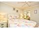 Bright bedroom featuring comfortable bedding, bedside tables, tasteful decor and a mirrored closet at 210 N Ocean Blvd. # 234, North Myrtle Beach, SC 29582