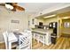 Cozy dining area adjacent to kitchen featuring bar stool seating at the kitchen counter with appliances at 210 N Ocean Blvd. # 234, North Myrtle Beach, SC 29582
