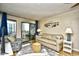 Inviting living room with cozy furniture, decor, sliding glass doors to balcony, and a neutral color palette at 210 N Ocean Blvd. # 234, North Myrtle Beach, SC 29582