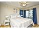 Inviting main bedroom featuring a comfortable bed, bright windows, and private balcony access with ocean views at 210 N Ocean Blvd. # 234, North Myrtle Beach, SC 29582