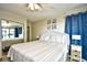 Serene main bedroom featuring a cozy bed, mirrored closet, side table and access to a private balcony at 210 N Ocean Blvd. # 234, North Myrtle Beach, SC 29582