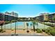 View of well maintained tennis courts surrounded by resort buildings at 210 N Ocean Blvd. # 234, North Myrtle Beach, SC 29582