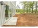 Backyard with patio and sliding glass doors, offering easy indoor-outdoor living at 2212 Dykman Circle, Little River, SC 29566