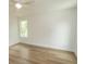 Bedroom featuring wood-look flooring, neutral walls, and a ceiling fan for added comfort at 2212 Dykman Circle, Little River, SC 29566