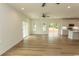 Bright and airy living room featuring beautiful flooring, recessed lighting, and sliding glass doors to the backyard at 2212 Dykman Circle, Little River, SC 29566