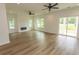 Spacious living room with modern fireplace, hardwood flooring, recessed lighting, and multiple windows at 2212 Dykman Circle, Little River, SC 29566