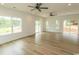 Expansive living area featuring hardwood floors, recessed lights, ceiling fans, and access to the outdoors at 2212 Dykman Circle, Little River, SC 29566