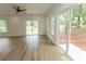 Bright living room with hardwood floors and large sliding doors opening to the outdoors at 2212 Dykman Circle, Little River, SC 29566