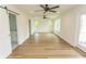 This main bedroom features hardwood floors, neutral walls, multiple windows and access to the ensuite bathroom at 2212 Dykman Circle, Little River, SC 29566