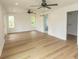 This main bedroom is spacious and features hardwood floors, neutral walls and 2 ceiling fans at 2212 Dykman Circle, Little River, SC 29566