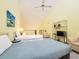 Bright bedroom featuring multiple beds, vaulted ceilings, and a cozy sitting area at 223 Maison Dr. # D-16, Myrtle Beach, SC 29572