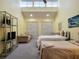 Spacious bedroom featuring two beds, ample closet space, and lofted ceilings at 223 Maison Dr. # D-16, Myrtle Beach, SC 29572