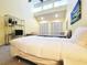 Bright bedroom with vaulted ceilings, two beds, a seating area and natural light at 223 Maison Dr. # D-16, Myrtle Beach, SC 29572