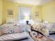 Bright bedroom featuring two comfortable beds, a window, and decorative accents at 223 Maison Dr. # D-16, Myrtle Beach, SC 29572