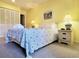 Cozy bedroom featuring a comfortable bed, lamps, and closet space at 223 Maison Dr. # D-16, Myrtle Beach, SC 29572