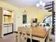 Charming dining area with a spiral staircase, open to the kitchen and living areas at 223 Maison Dr. # D-16, Myrtle Beach, SC 29572