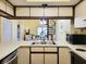 Kitchen view showcasing bar and view of dining room, living room, and spiral staircase at 223 Maison Dr. # D-16, Myrtle Beach, SC 29572