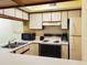 Well-equipped kitchen with appliances, ample counter space, and light-colored cabinetry at 223 Maison Dr. # D-16, Myrtle Beach, SC 29572