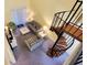 Open living room featuring comfortable seating, spiral staircase, and plenty of natural light at 223 Maison Dr. # D-16, Myrtle Beach, SC 29572