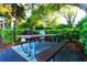 Community picnic area featuring charcoal grill and picnic table under shady trees at 223 Maison Dr. # D-16, Myrtle Beach, SC 29572