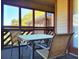 Screened porch with table and chairs and view of the outdoors at 223 Maison Dr. # D-16, Myrtle Beach, SC 29572