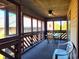 Screened in porch with table and chairs, ceiling fan, and wood accents at 223 Maison Dr. # D-16, Myrtle Beach, SC 29572