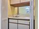 Wet bar featuring white cabinets, a sink, and a view into the dining area at 223 Maison Dr. # D-16, Myrtle Beach, SC 29572