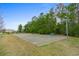 Outdoor basketball court with benches and well maintained landscape within a welcoming community at 2262 Andover Dr. # E, Surfside Beach, SC 29575