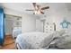 Comfortable bedroom with a mirrored closet, ceiling fan, and a nautical theme at 2262 Andover Dr. # E, Surfside Beach, SC 29575