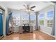 Bright bedroom/office with large windows and ceiling fan at 2262 Andover Dr. # E, Surfside Beach, SC 29575