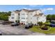 Spacious condo building with on-site parking and landscaping with seasonal flowers at 2262 Andover Dr. # E, Surfside Beach, SC 29575