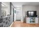 Open-concept with stylish TV console, granite counters, and modern backsplash at 2262 Andover Dr. # E, Surfside Beach, SC 29575
