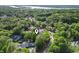 Aerial shot showcasing a home nestled among lush trees, offering privacy and natural beauty at 228 Hopeland St., Pawleys Island, SC 29585
