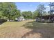 Expansive backyard with lush greenery, perfect for recreation and relaxation; boat included at 228 Hopeland St., Pawleys Island, SC 29585