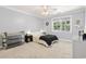 Comfortable bedroom with neutral decor and large window at 228 Hopeland St., Pawleys Island, SC 29585