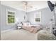 Cozy bedroom with natural light, carpet, and quaint décor accents at 228 Hopeland St., Pawleys Island, SC 29585