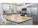 Bright kitchen with granite countertops, stainless steel appliances, and white cabinets at 228 Hopeland St., Pawleys Island, SC 29585