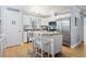 Modern kitchen with stainless steel appliances, granite countertops, and a center island at 228 Hopeland St., Pawleys Island, SC 29585