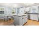 Open kitchen and dining area with hardwood floors and granite countertops at 228 Hopeland St., Pawleys Island, SC 29585