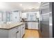 Eat-in kitchen featuring stainless steel appliances, granite countertops, and hardwood floors at 228 Hopeland St., Pawleys Island, SC 29585