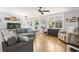 Bright living room with hardwood floors, comfortable seating, and a decorative aquarium at 228 Hopeland St., Pawleys Island, SC 29585