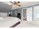 This bedroom features gray walls with white trim, and adjoins the primary bath at 228 Hopeland St., Pawleys Island, SC 29585