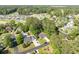 Aerial view of neighborhood homes with mature landscaping, surrounded by mature trees, ponds, and golf course at 2405 Brick Dr., Longs, SC 29568