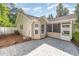 Paver patio leads to a screened porch of a home with neutral siding, and a partially fenced in yard at 2405 Brick Dr., Longs, SC 29568